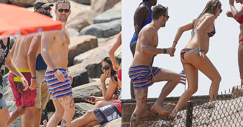 原來也是刺青狂！萊恩雷諾斯與嬌妻海邊曬恩愛 腿上刺青曝光