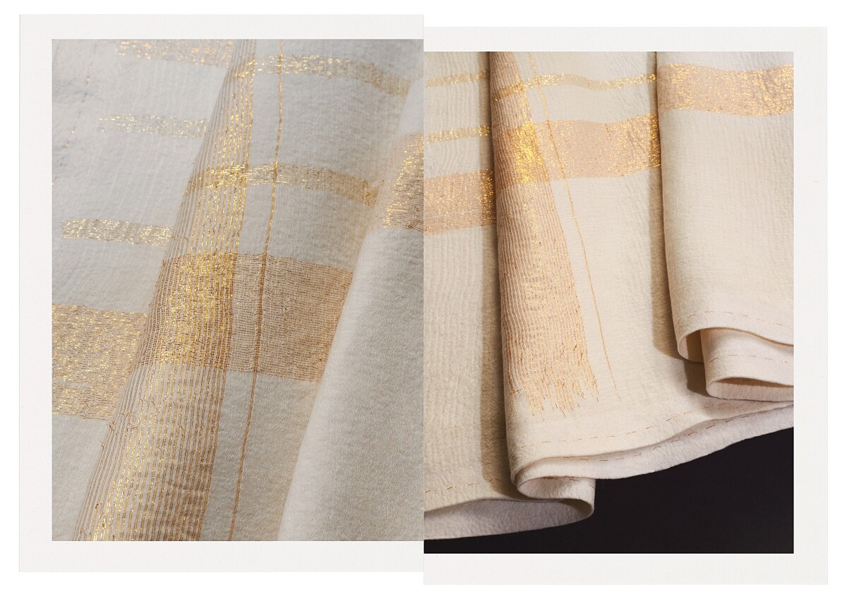 白色喀什米爾羊絨氈與金絲線交織的 M&eacute;ridien 格紋毯。