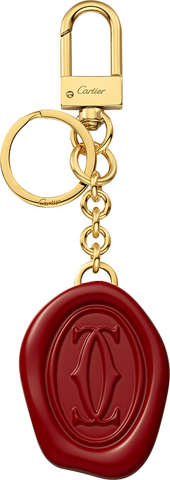 Diabolo de Cartier封蠟章圖案鑰匙圈 金色鍍層飾面紅色樹脂，點綴封蠟章圖案 參考價格約NT$ 16,800