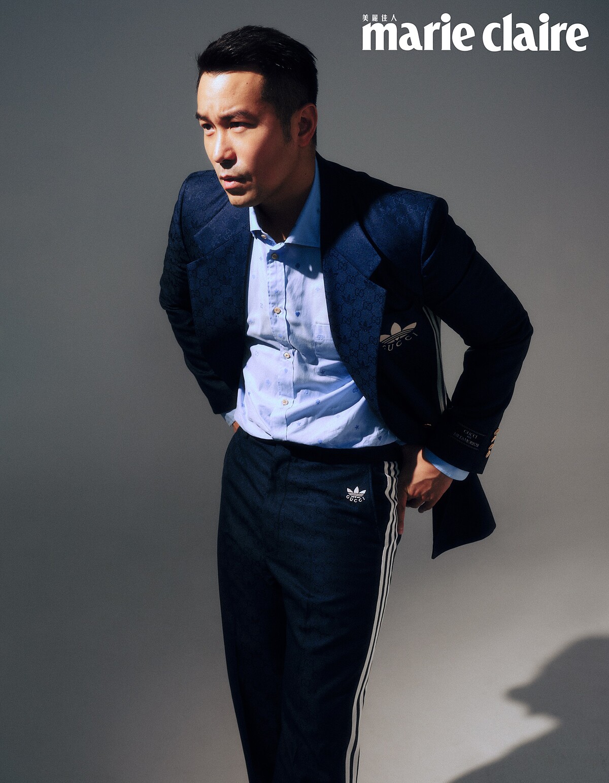 adidas x Gucci 藍色GG緹花刺繡夾克、西裝褲、藍色襯衫,all by Gucci。