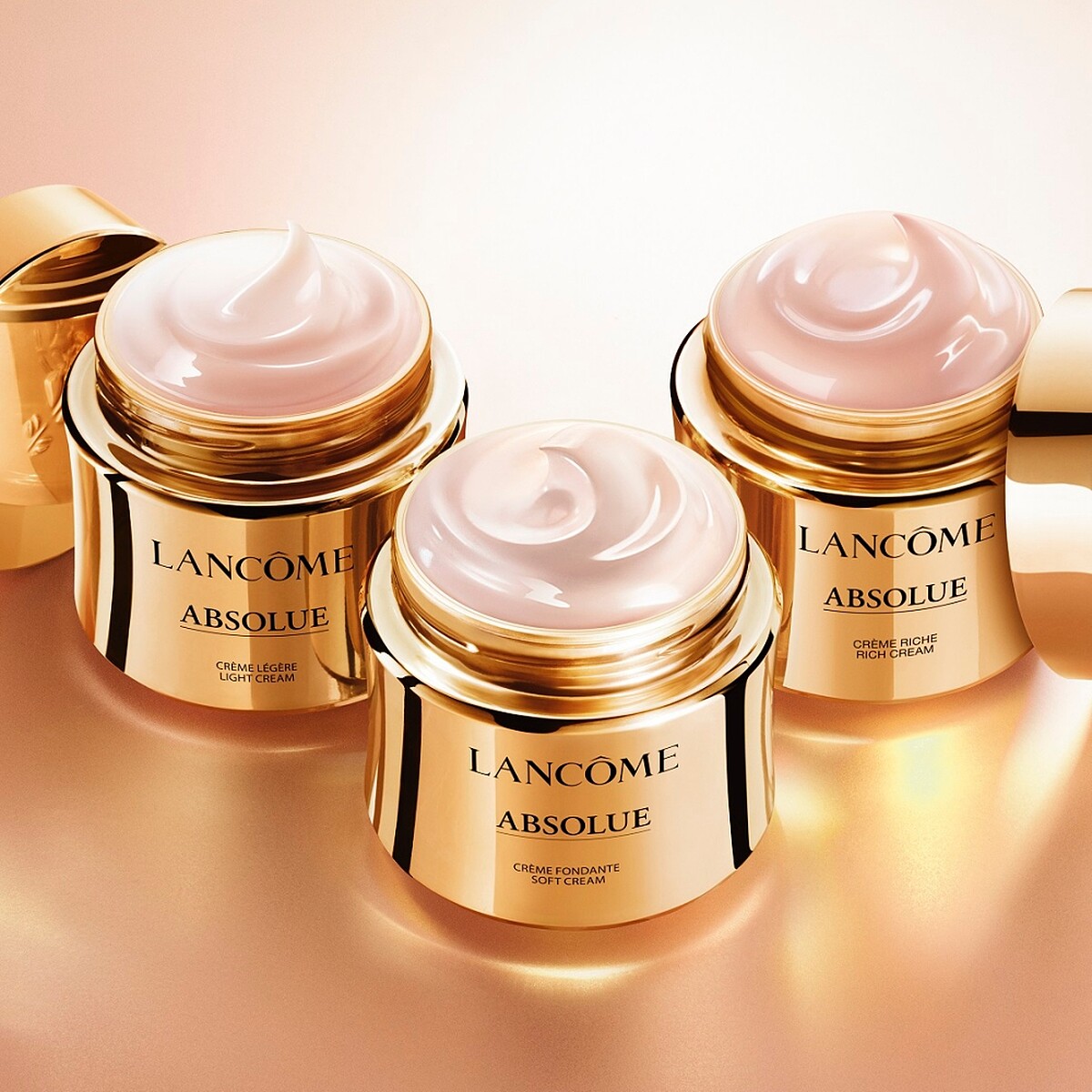 蘭蔻絕對完美黃金玫瑰修護乳霜系列,由左至右為輕盈版、經典版、豐潤版)。