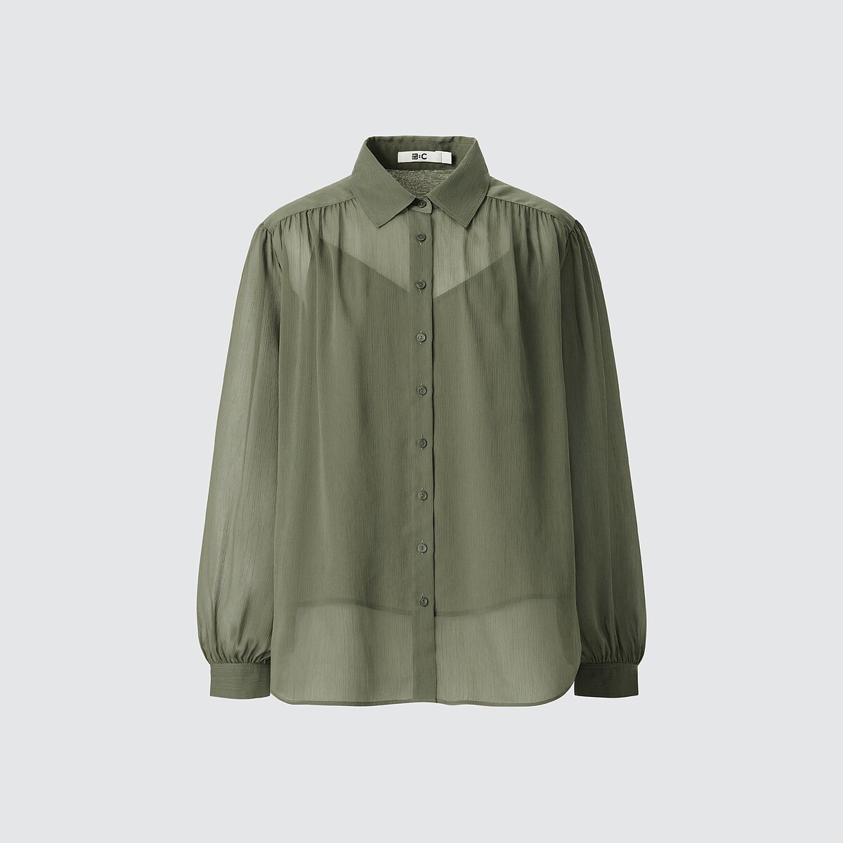 透膚澎袖上衣NT$990。