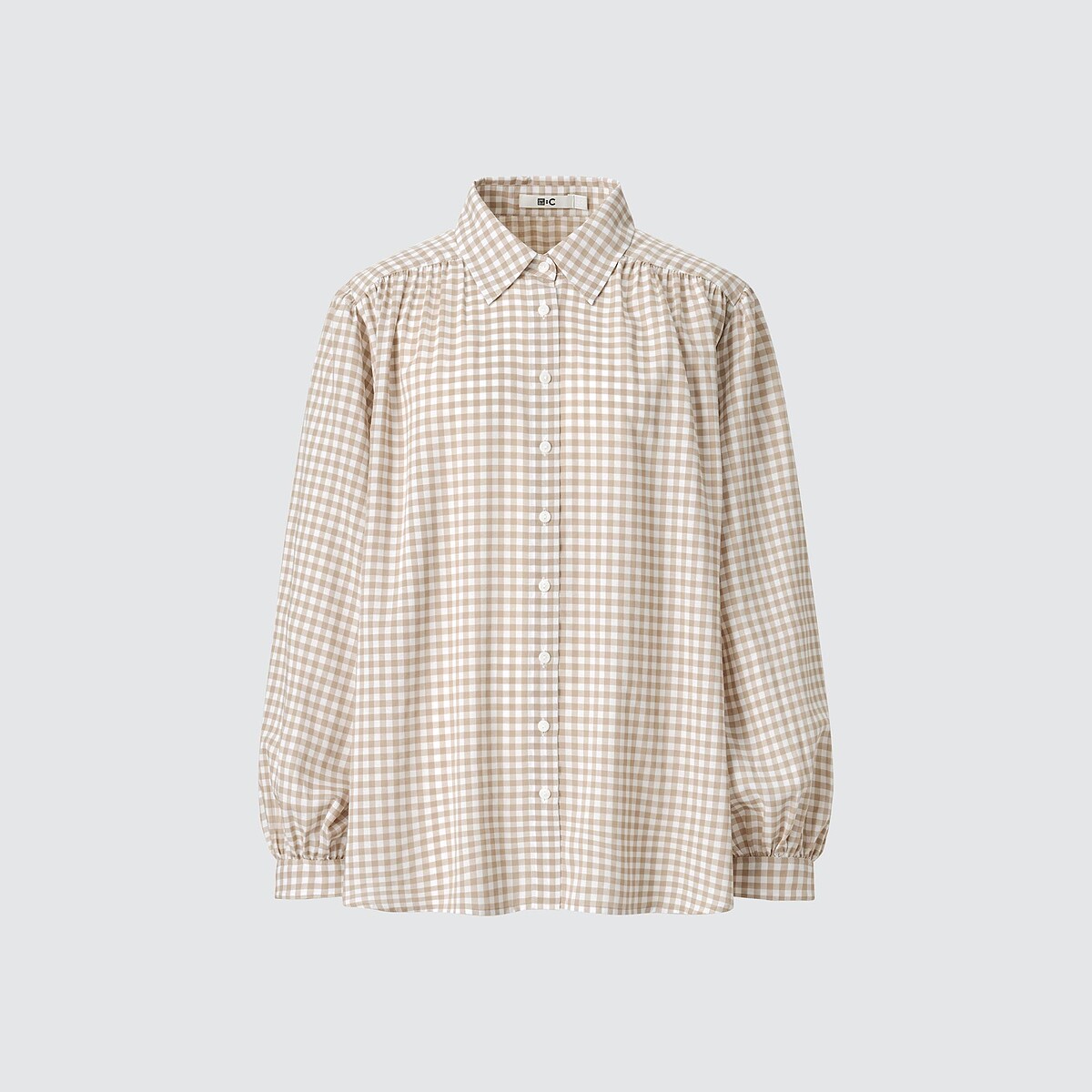 透膚澎袖抓皺上衣NT$990。