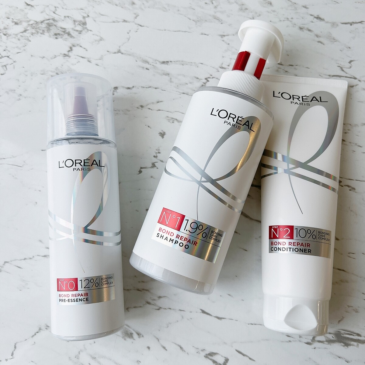 巴黎萊雅髮芯修護強化系列，左起為髮芯修護強化洗前精華、髮芯修護強化洗髮露、髮芯修護強化護髮素，上面的數字代表髮芯修護複合精華含量。
