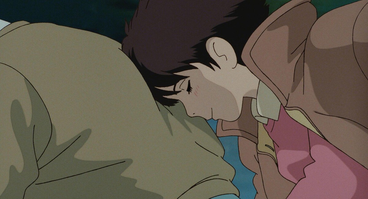 《心之谷》經典畫面，小雫乘坐聖司的腳踏車，頭靠在聖司背上