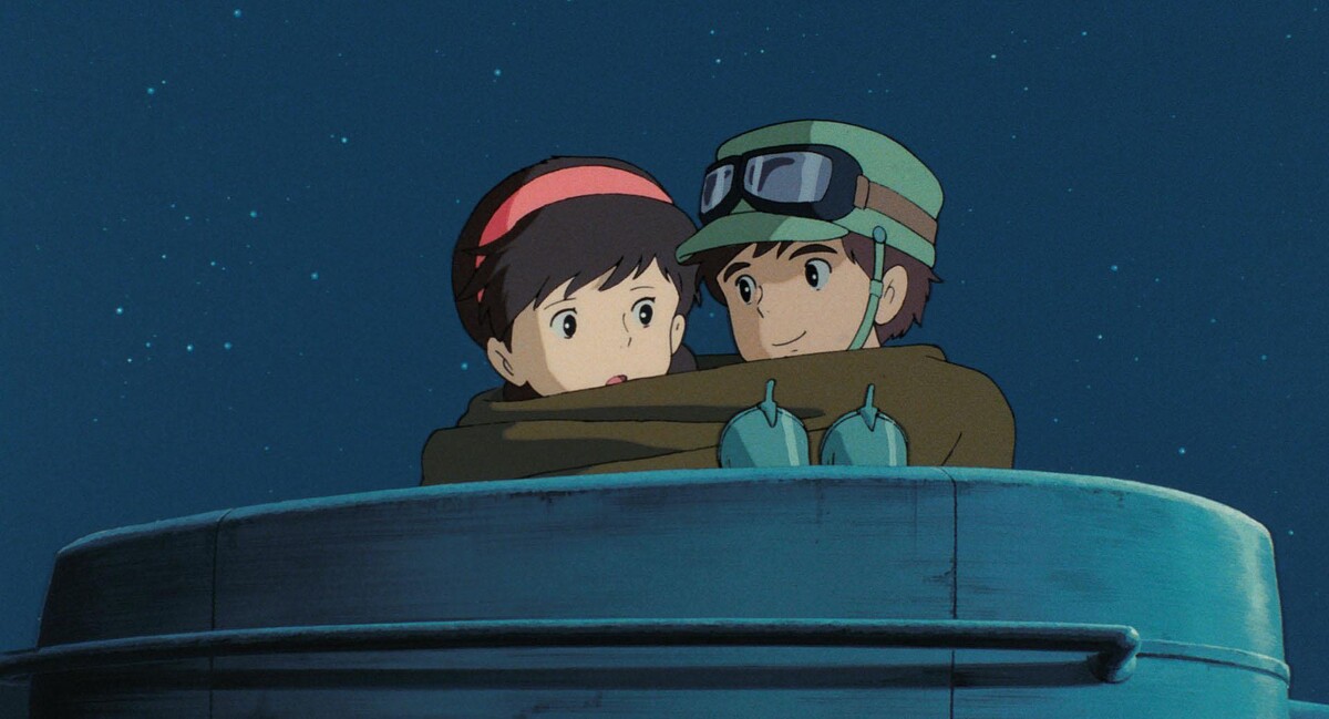 巴魯用毯子包裹希達，把整個人拉往自己懷裡