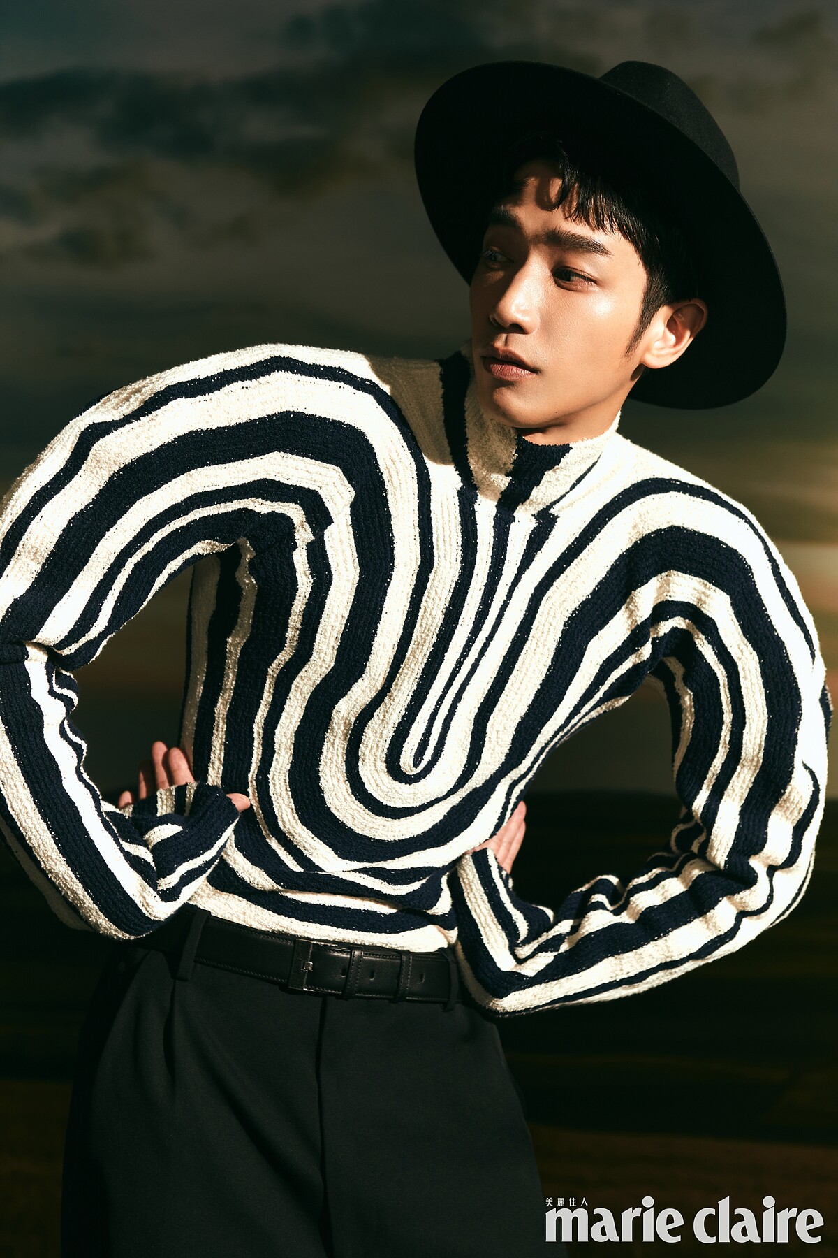 （劉以豪）黑色紳士帽，Celine Homme；黑白條紋針織衫、黑色寬褲，both by Bottega Veneta。