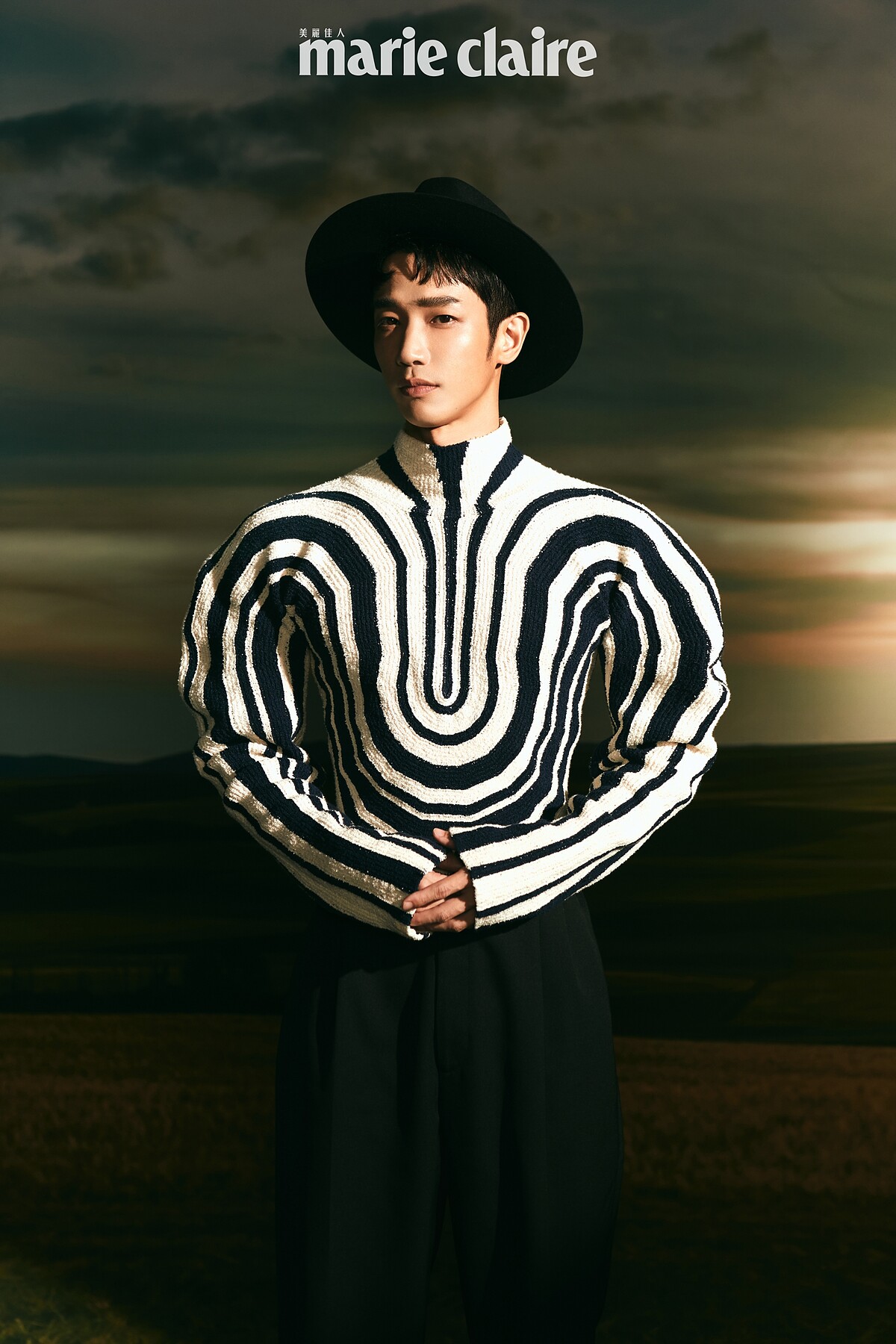 （劉以豪）黑色紳士帽，Celine Homme；黑白條紋針織衫、黑色寬褲，both by Bottega Veneta。