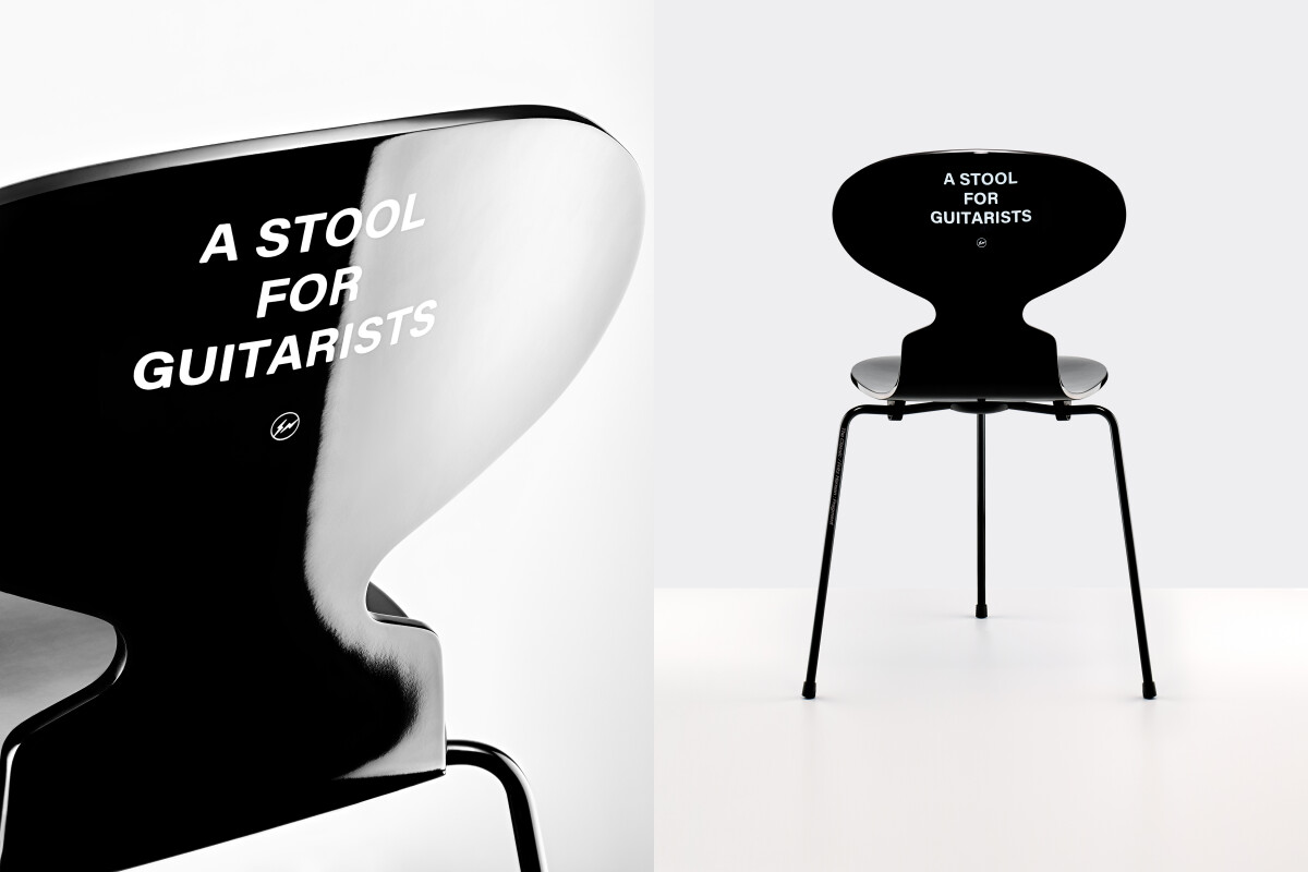 三腳結構、鋼琴烤漆、椅背上醒目的「A STOOL FOR GUITARISTS」白色標語。