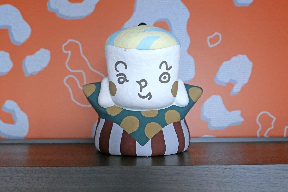 神情逗趣的「福助」人偶臉上還寫著「Canopy」的字樣。