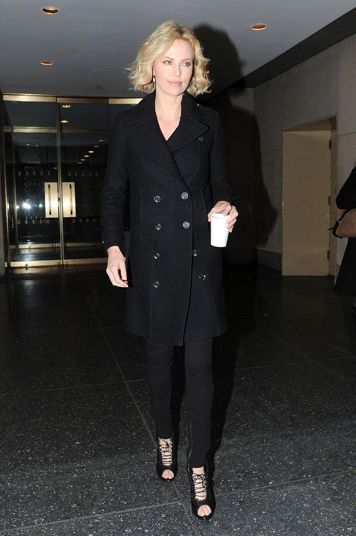 Charlize Theron wearing Burberry in New York