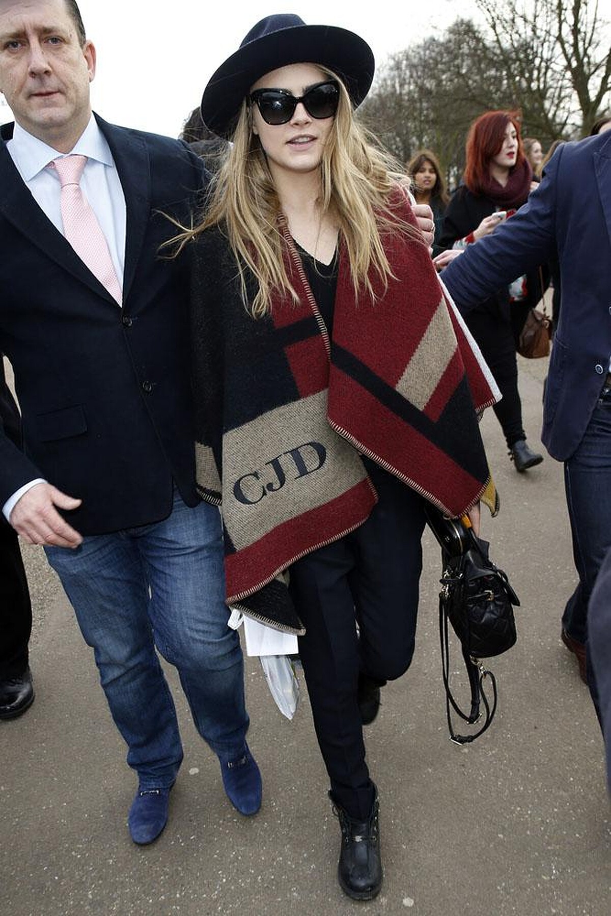 Cara Delevingne wearing Burberry Monogram Poncho 