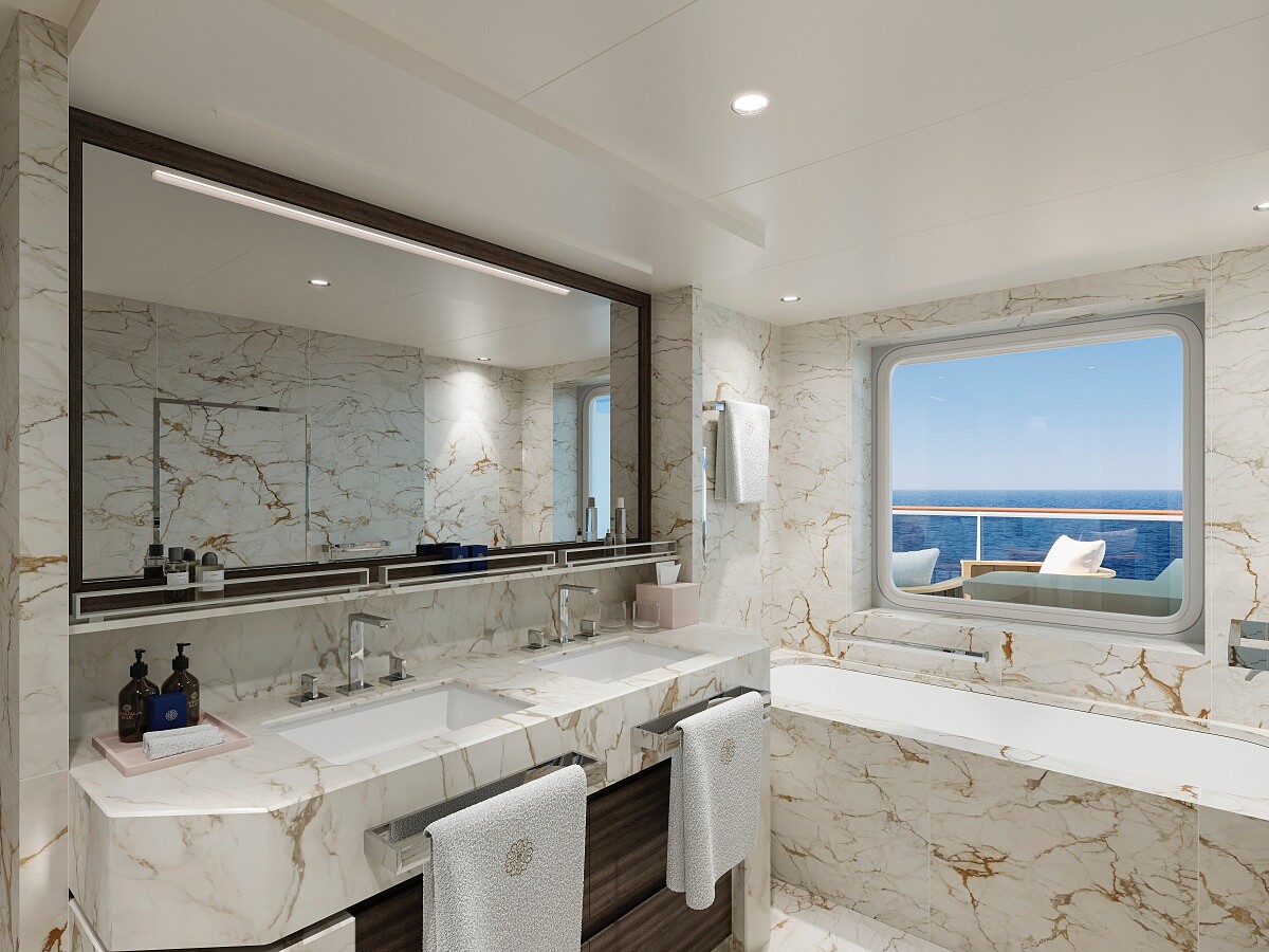 大理石浴室設有雙洗手台、浴缸與蒸氣室。