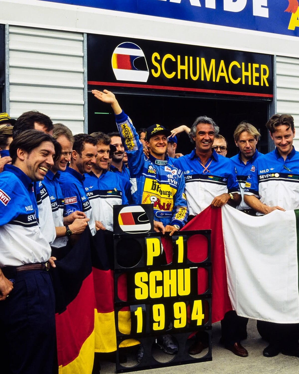 Flavio Briatore 作為車神 Michael Schumacher 的伯樂,打造班尼頓車隊的黃金年代。